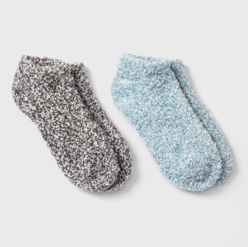 A pair of grey and a pair of blue cozy socks