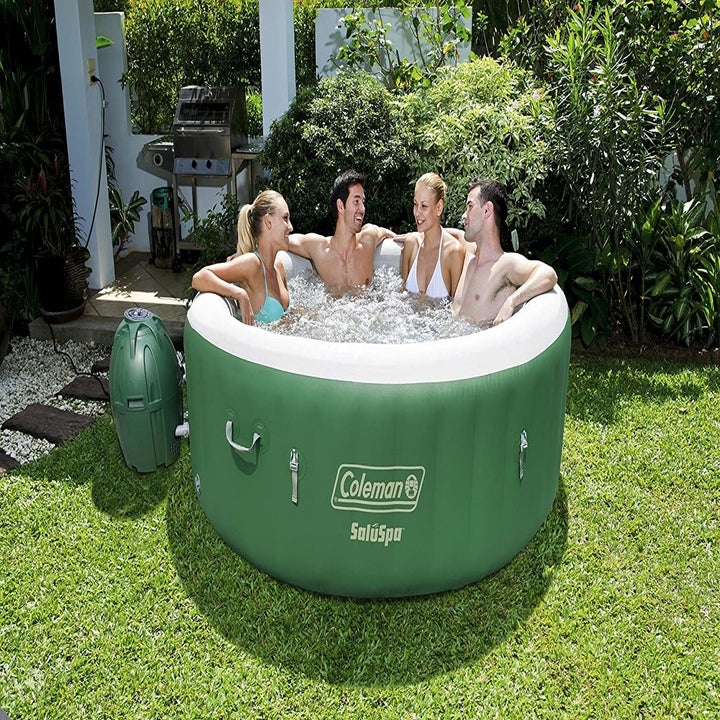 people hang out in inflatable tub 