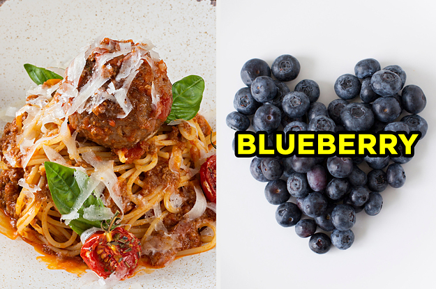 On the left, some spaghetti and meatballs topped with shaved parmesan cheese, and on the right, some blueberries arranged into the shape of a heart labeled