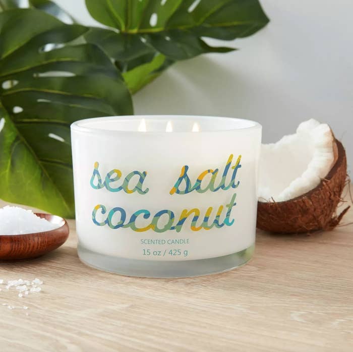 the sea salt coconut candle with three wicks burning