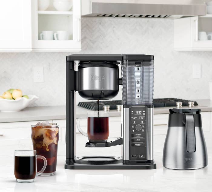 a coffee maker staged in a kitchen