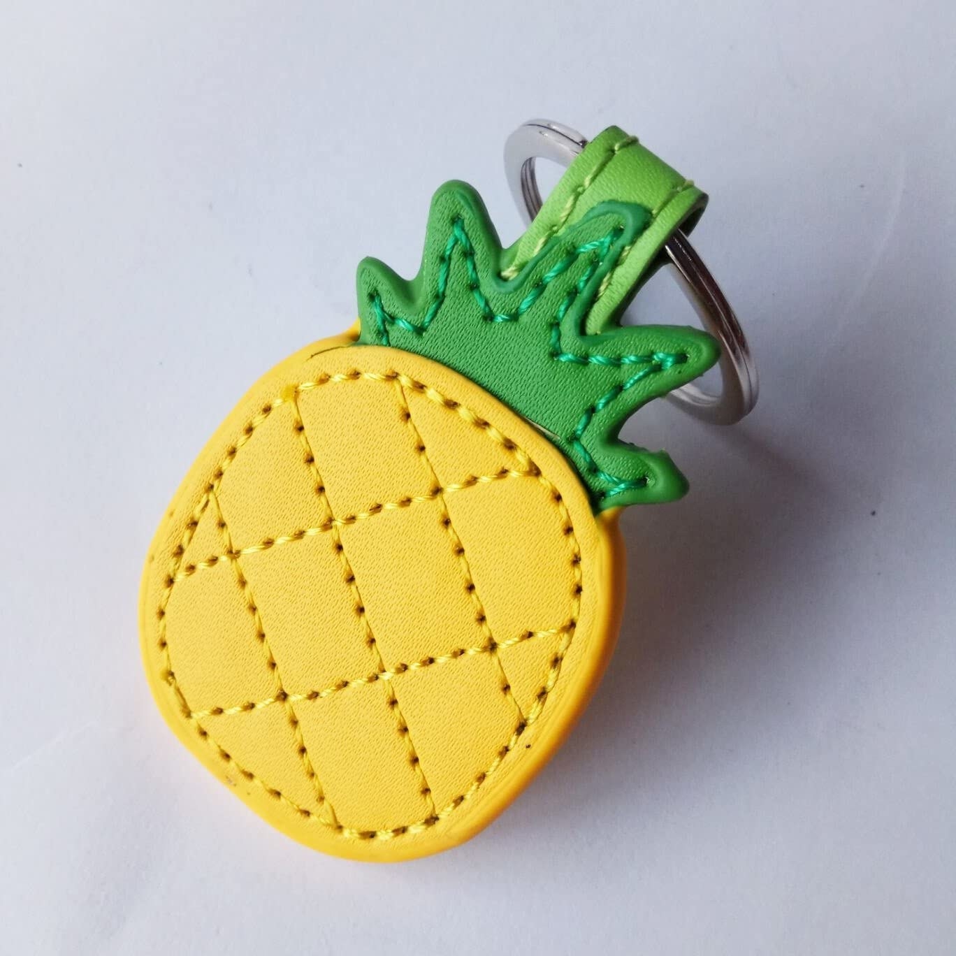 A leather pineapple-shaped keychain