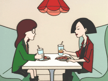 Daria and Jane from the show Daria cheers-ing over pizza 