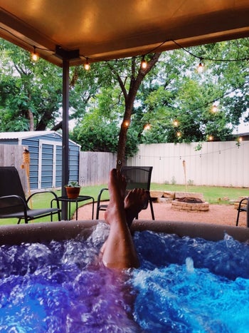Reviewers feet sticking out of the hot tub
