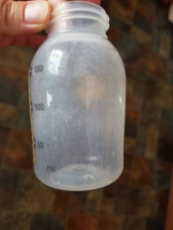 Reviewer's photo showing a dirty milk bottle