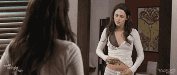  Bella touching her stomach