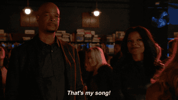 gif of roger from the show lethal weapon at a club saying &quot;that&#x27;s my song&quot;