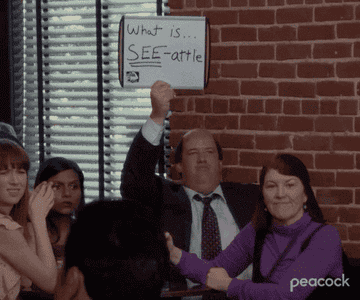 gif of kevin from the office raising up an answer card that reads &quot;what is see-attle&quot;