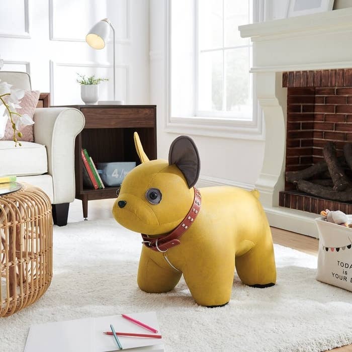 The dog ottoman in yellow, in a living room