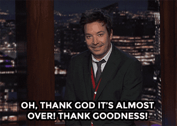 GIF of jimmy fallon on his late night show saying "oh, thank god it's almost over, thank goodness"