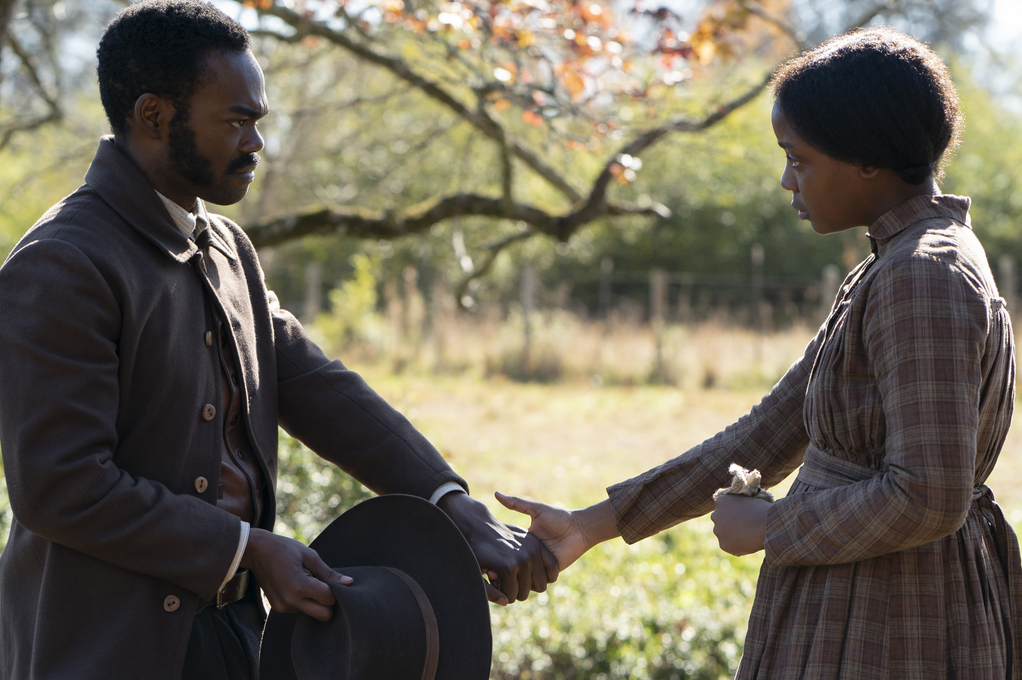 William Jackson Harper as Royal holding hands with Thuso Mbedu as Cora Randall
