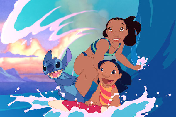 Stitch (voiced by Chris Sanders), Nani (Tia Carrere), and Lilo (Daveigh Chase) riding a wave.