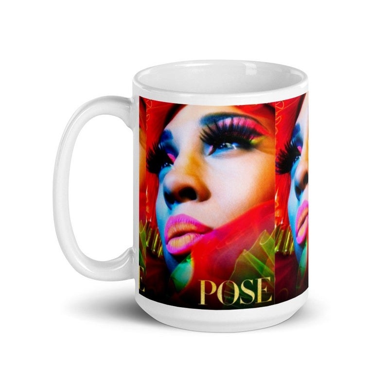 a mug with a photo of Blanca from the original TV promo shoot which shows her with long lashes and bright, fun makeup. It also says Pose at the bottom in large letters.