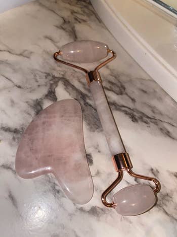 the pink jade roller and gua sha