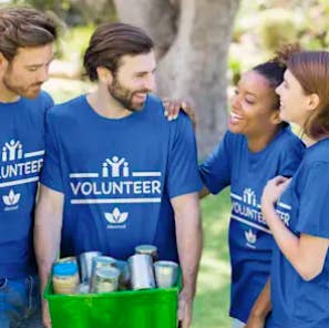 A group of volunteers wearing a shirt designed by Vistaprint