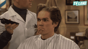 GIF of van from Reba looks sad as he realizes his barber buzzed his hair straight down the middle