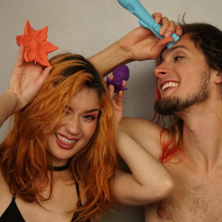 Models holding orange star-shaped vibrator, purple squid vibrator and teal fantasy vibrator