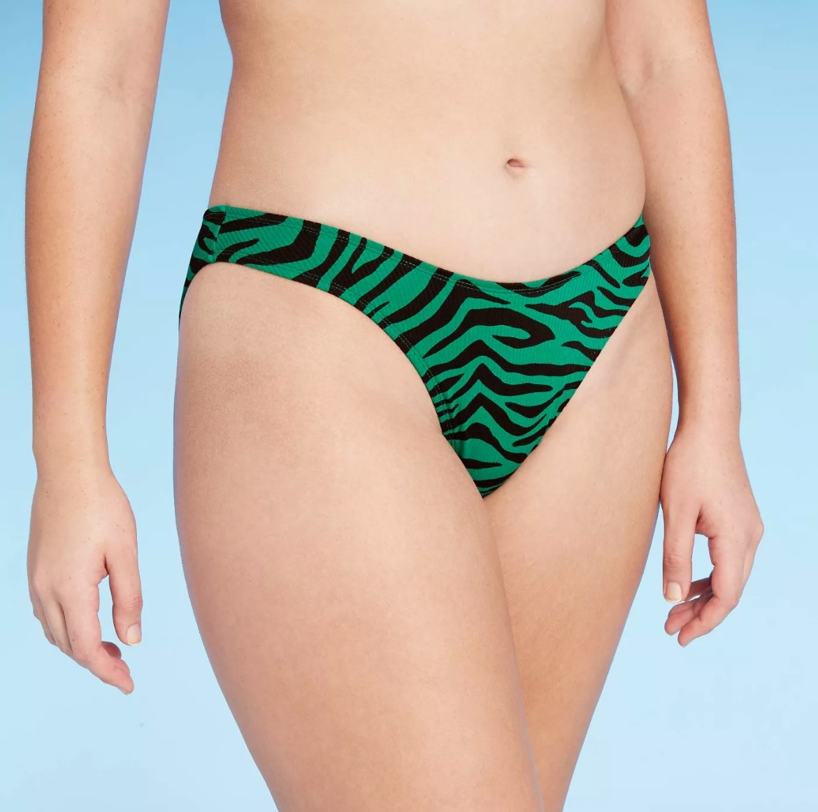 model wearing the green zebra bikini bottoms