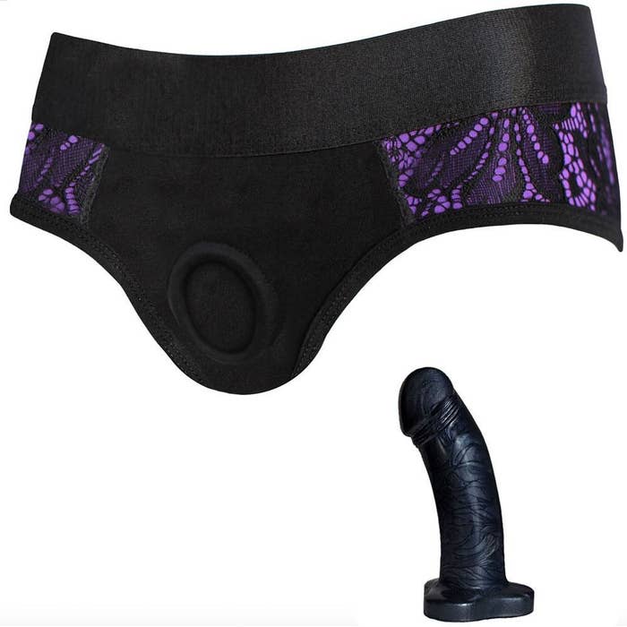 Black and purple lace panty harness with O-ring and black fantasy dildo