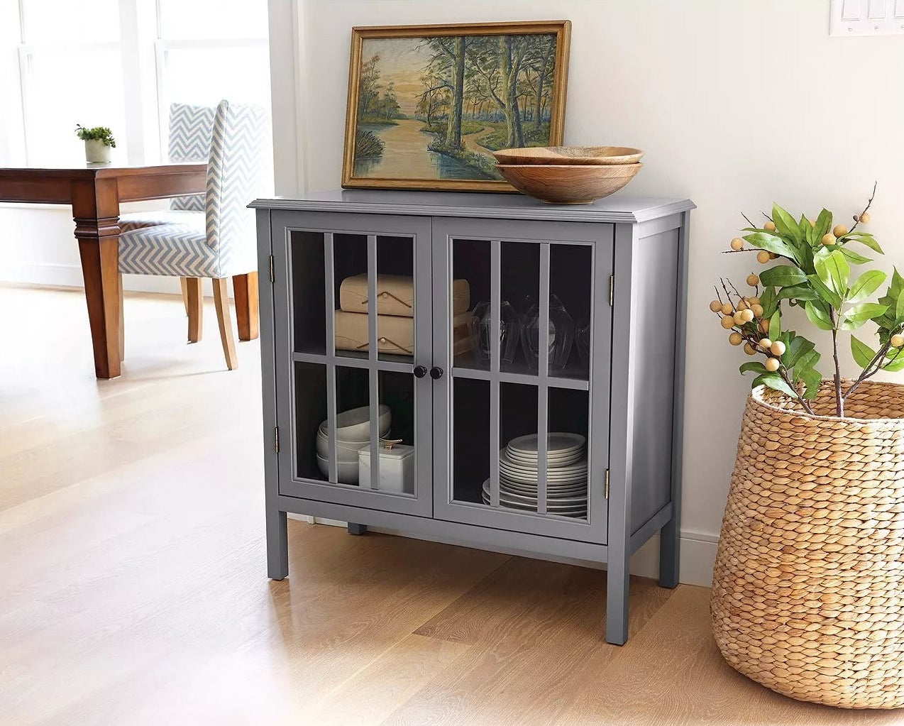 The cabinet with two glass doors in a living room