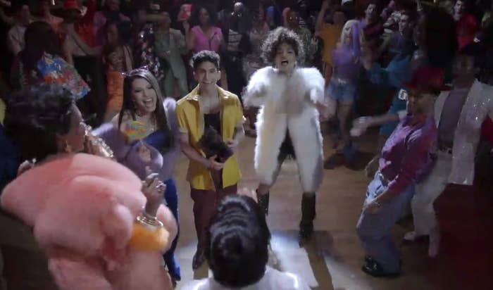 Elektra, Lulu, Papi, Angel, and Ricky surrounding Blanca on the dancefloor