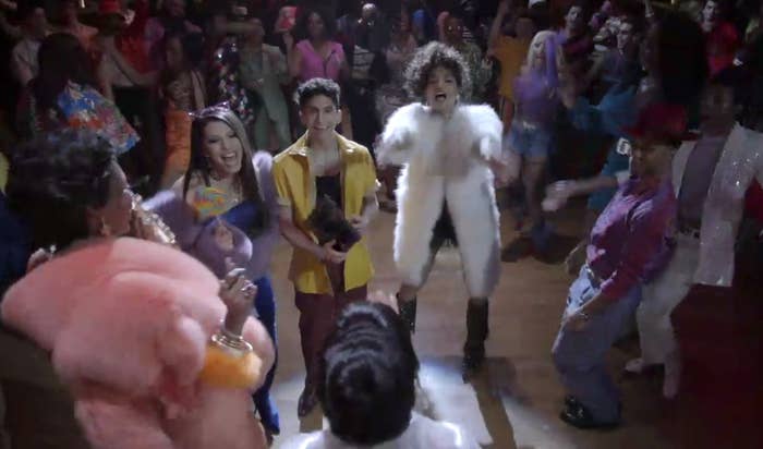 Elektra, Lulu, Papi, Angel, and Ricky surrounding Blanca on the dancefloor 