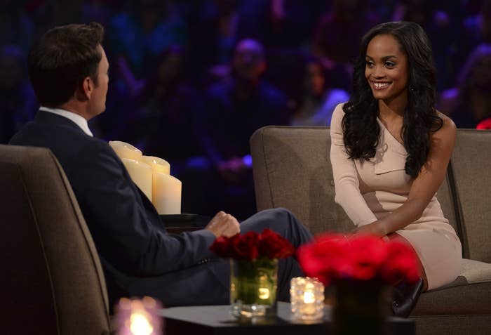 Rachel sits across from Chris at a Bachelor taping