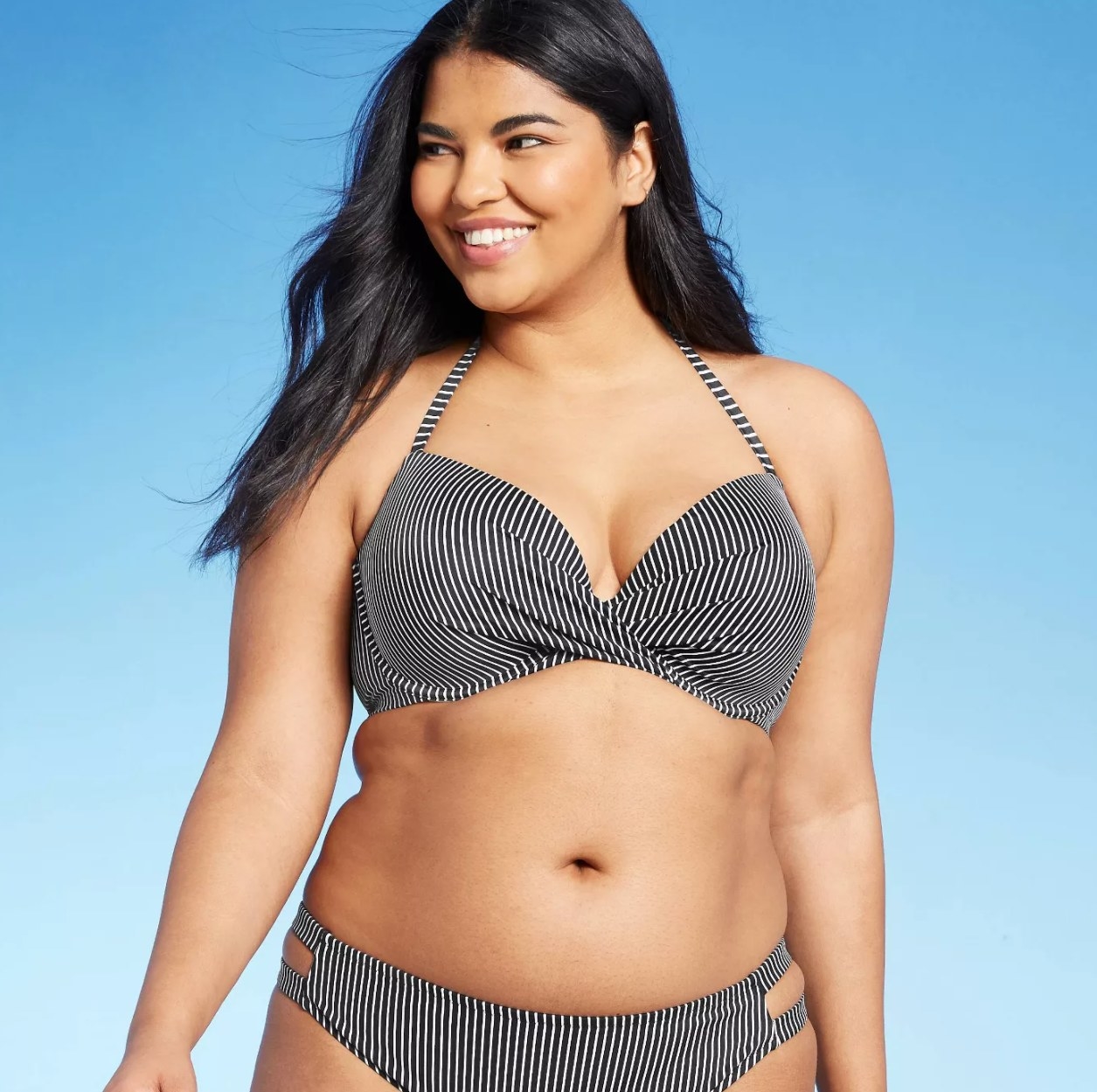 model wearing the black and white striped bikini top 