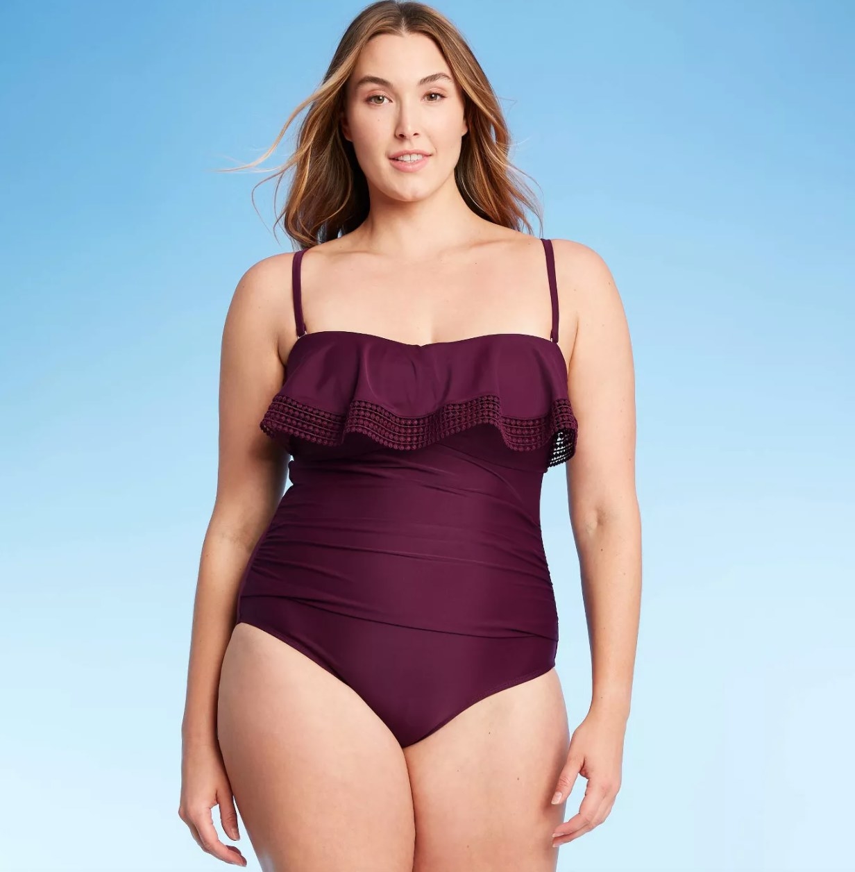 model wearing the purple ruffled swimsuit