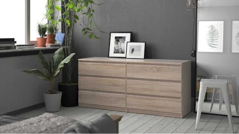 grey wood double dresser with six shelves against a wall
