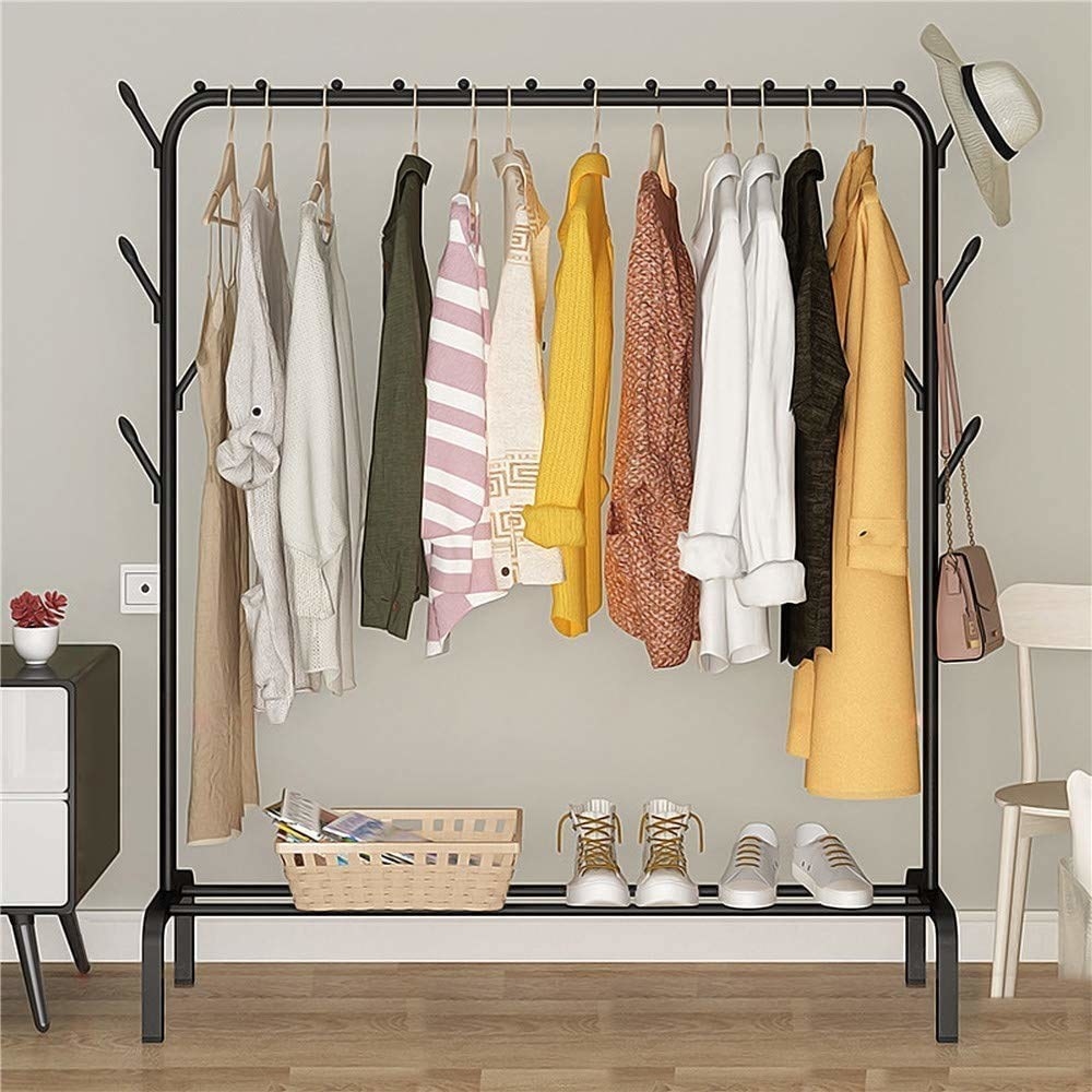 A clothing rack with clothes and shoes on it 