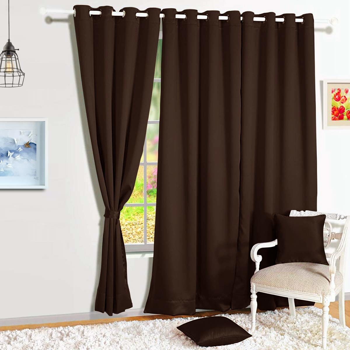 A pair of brown blackout curtains on a window.