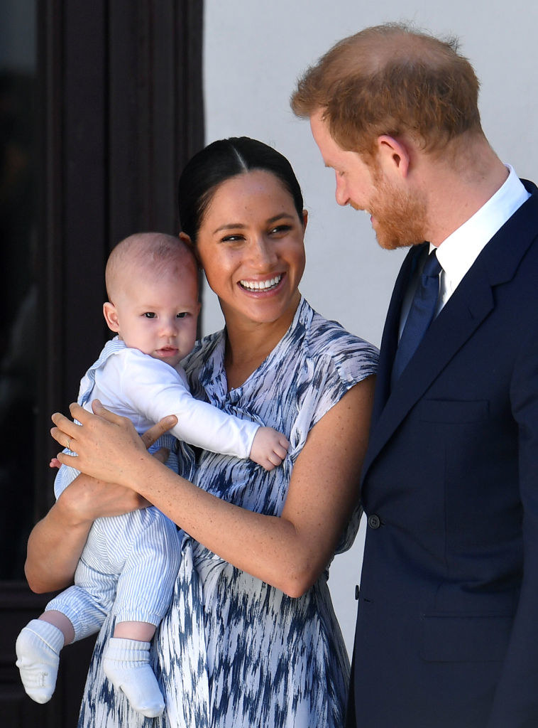 Prince Harry smiles at Meghan Markle as she holds their then-newborn son, Archie Harrison