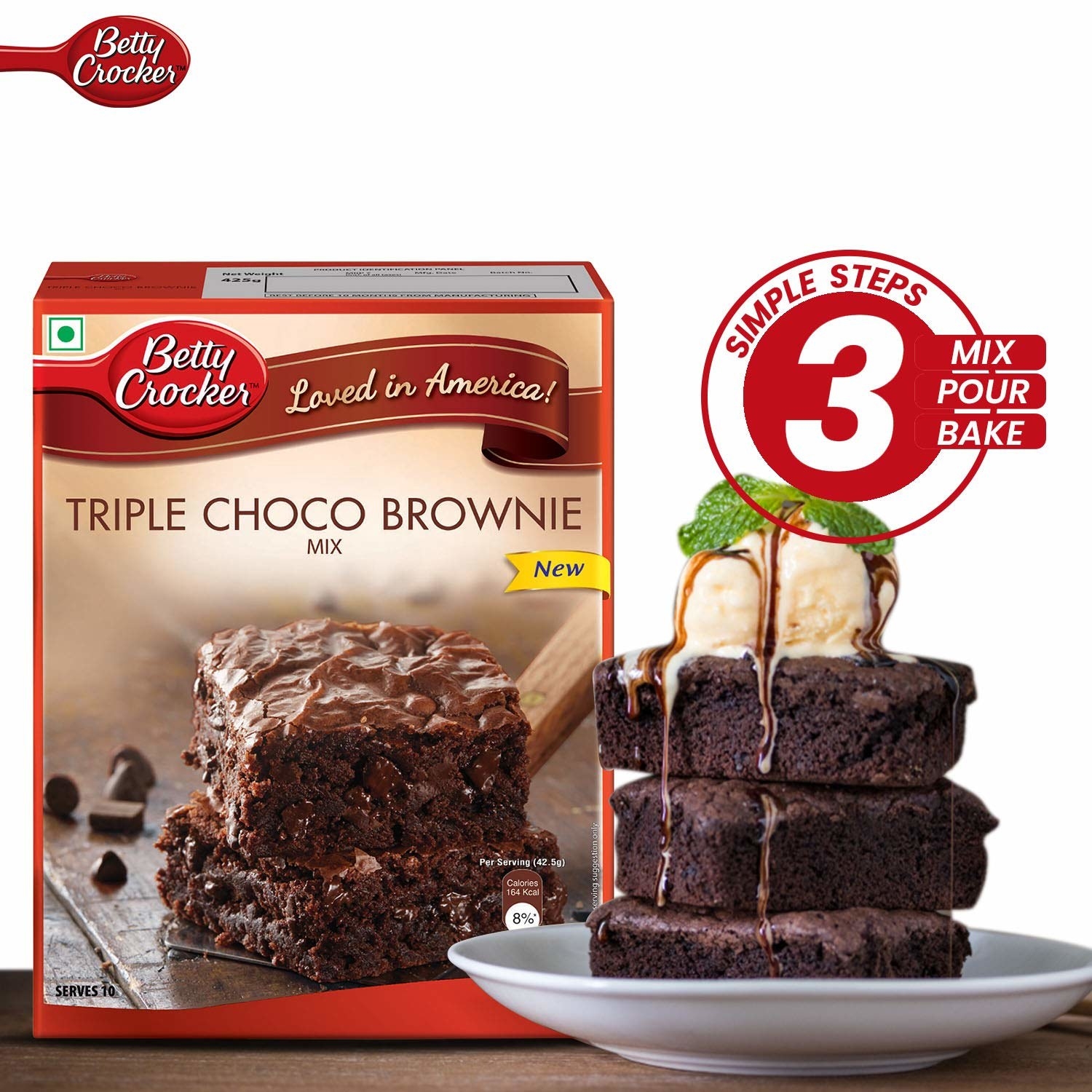 Brownie mix packet next to a plate of brownies with ice-cream on them.