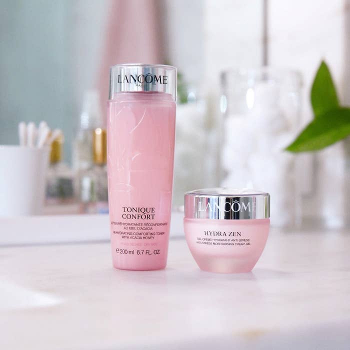 A pink container of moisturizer and toner