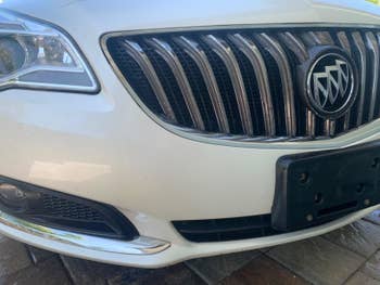 Reviewer photo of a white car with a clean bumper free of bug guts