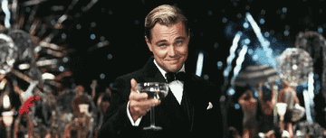 Jay Gatsby toasting champagne with fireworks in the background