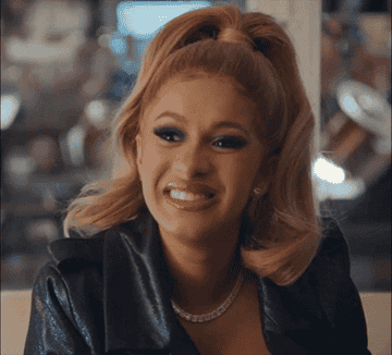 Cardi B&#x27;s smile is frozen as her eyes widen and she cringes