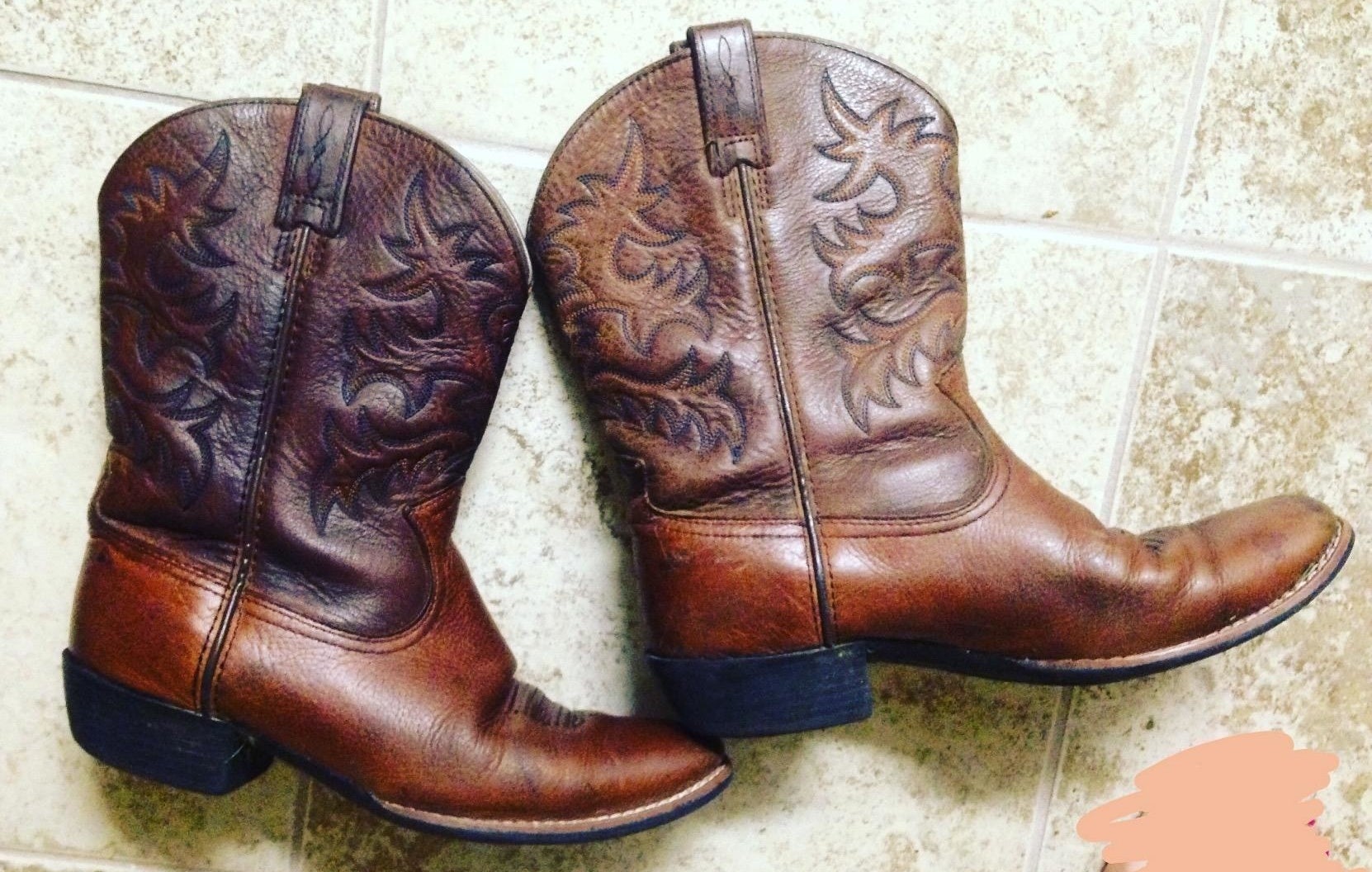 reviewer&#x27;s boots restored to looking brand new after using a leather conditioner