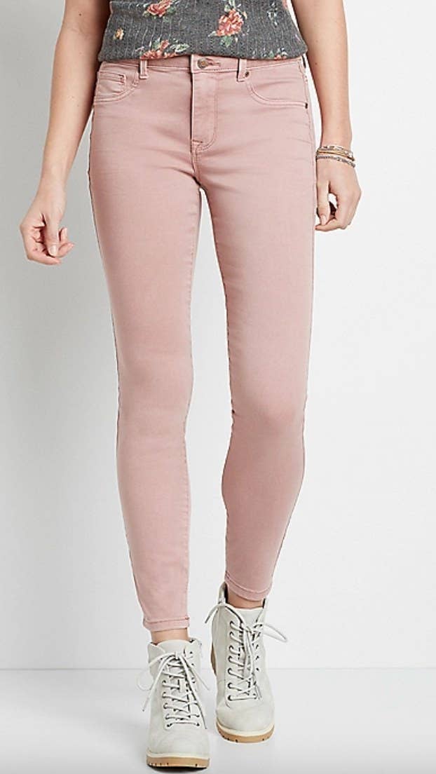 the pair of pink high rise jeans on a model