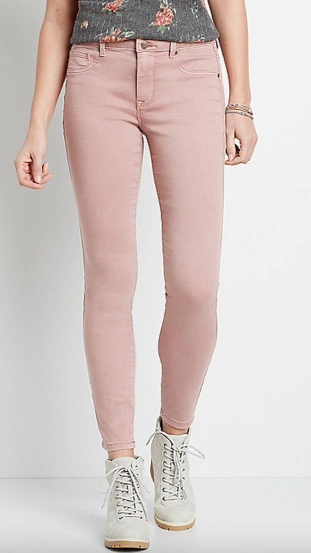 the pair of pink high rise jeans on a model