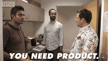 a gif of someone spraying hairspray on two individuals and saying &quot;you need product&quot;