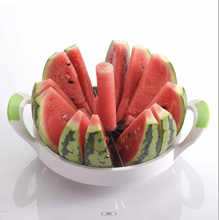 A watermelon separated into different slices after being cut with the slicer.