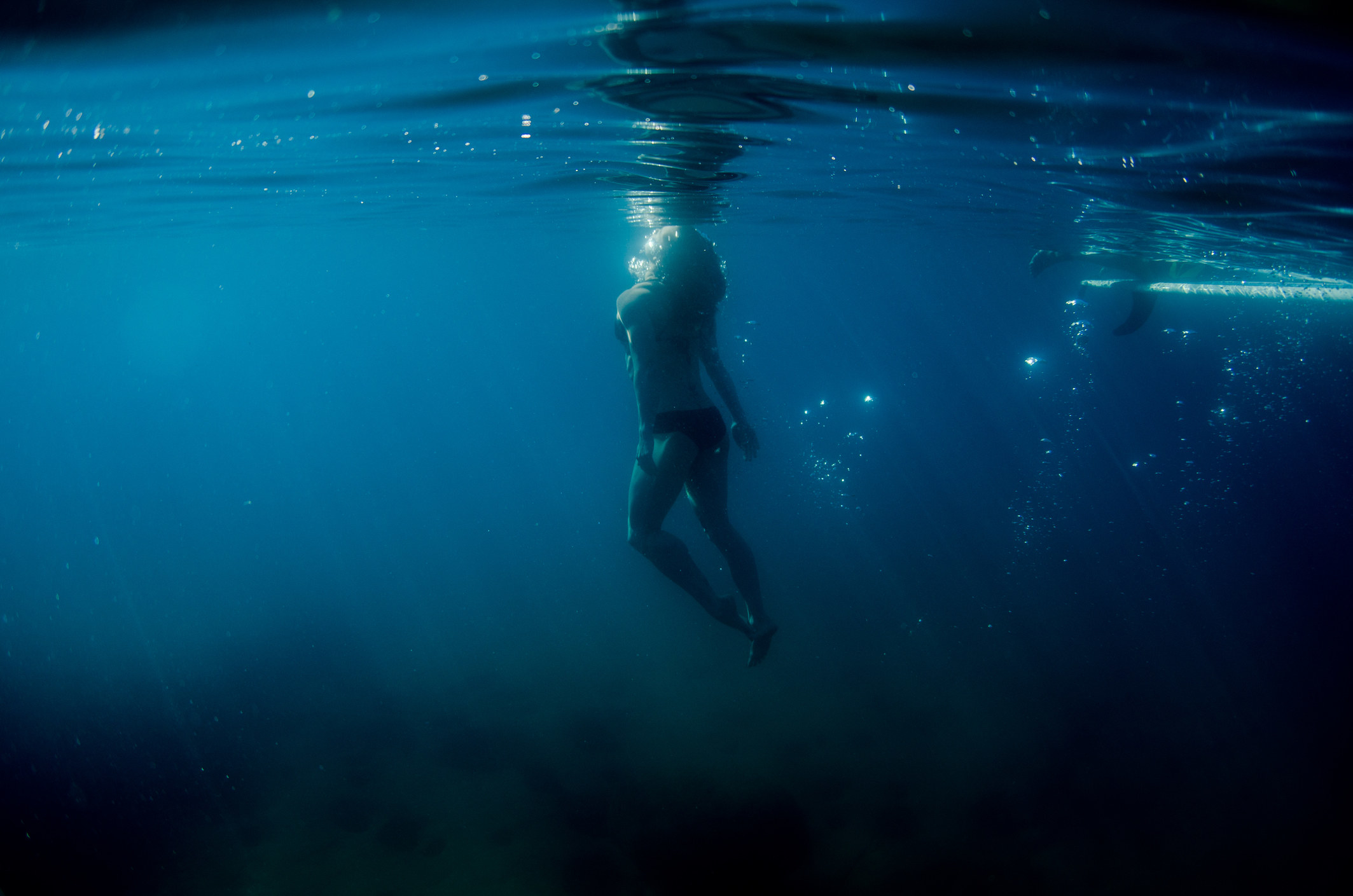 A person swimming under water