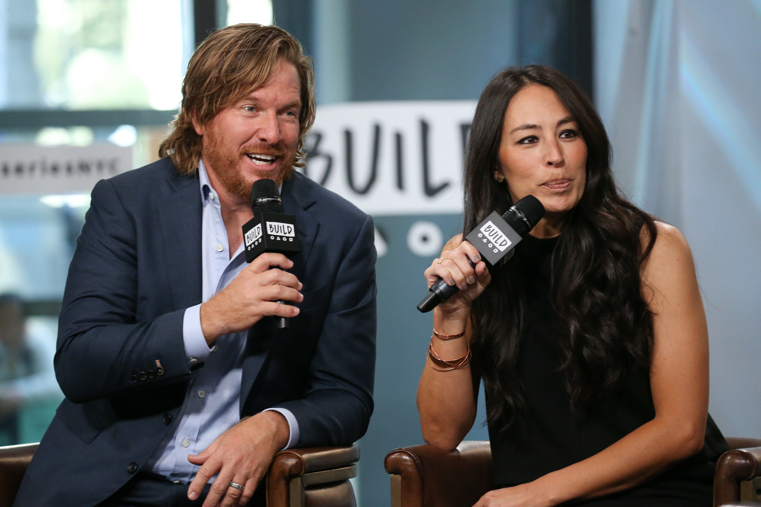 Chip Gaines and Joanna Gaines speak at an event
