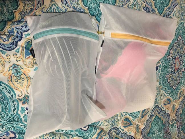 reviewer's two mesh bags with bras inside of it