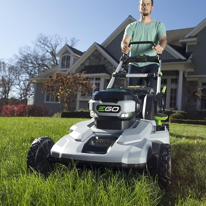 Light gray and black lawnmower with green accents