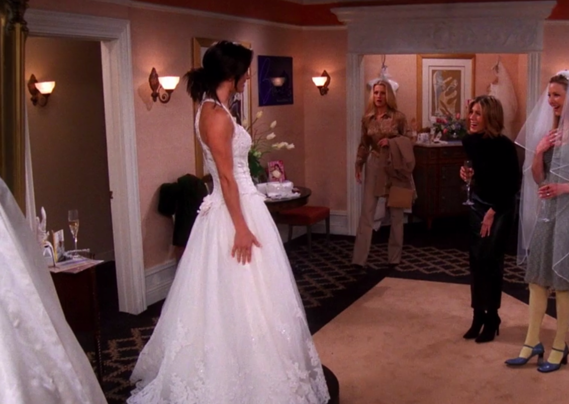 Monica wearing a ballgown with straps and a sweetheart neckline