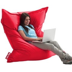 Model sitting on red bean bag chair
