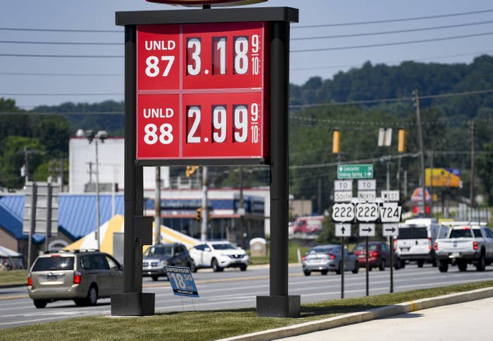 Gas station sign showing prices at $3.18 and $2.99 per gallon